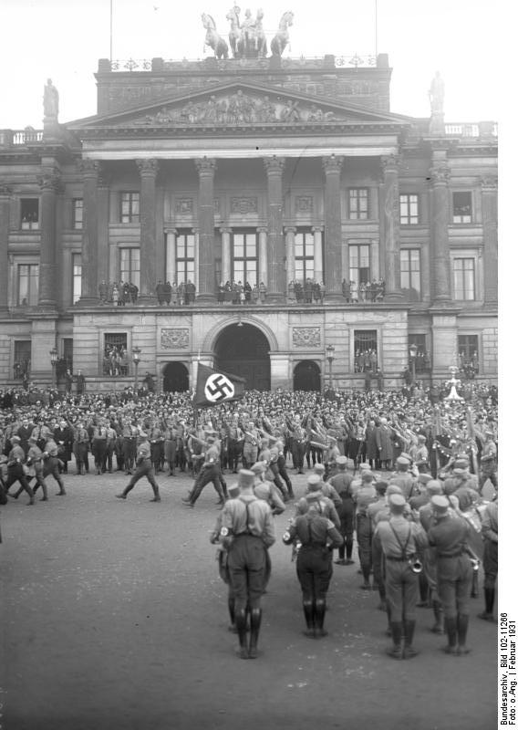 Adolf Hitler reviewing a Party rally in Braunschweig